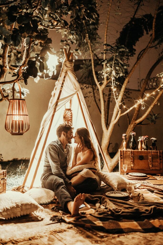 a man and a woman sitting down to a romantic dinner